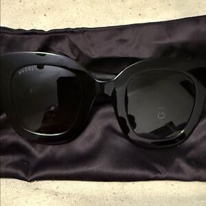 Women fancy Gucci sun glasses.